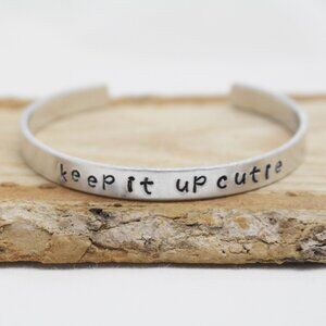 Keep It Up Cutie - Hand Stamped Anodized Aluminum Bangle - Adjustable